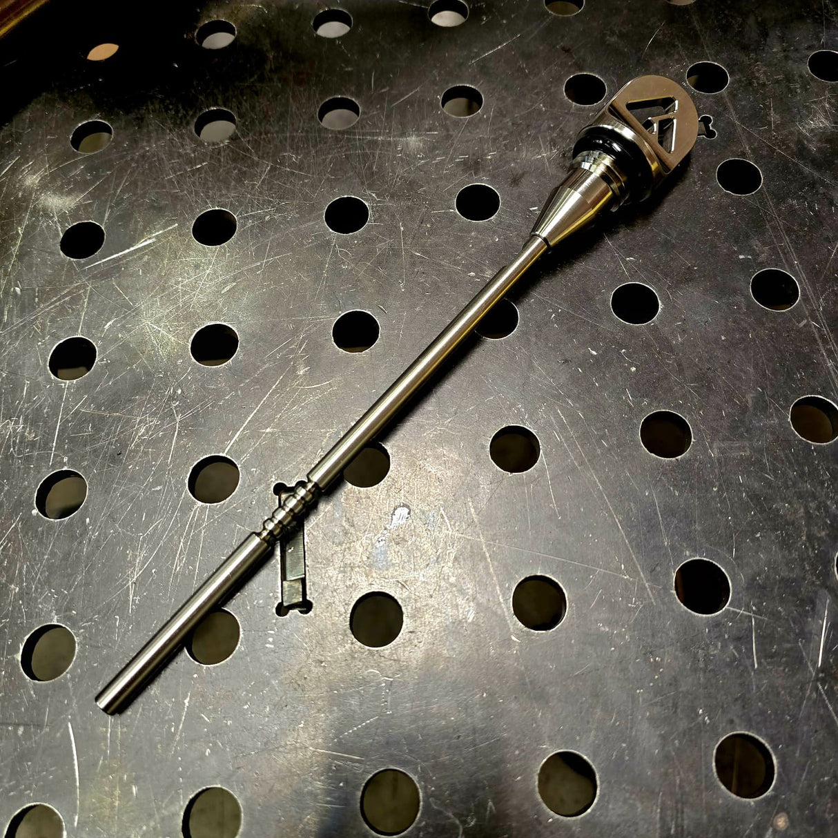 AVID Racing Can-Am Maverick R Dipstick on metal shop bench