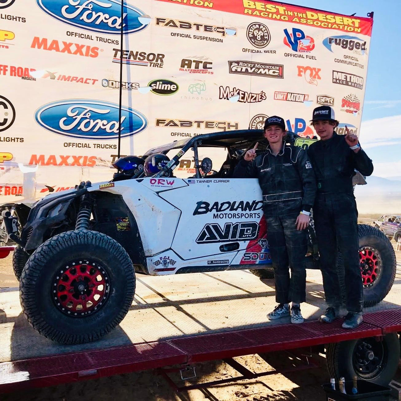 AVID Racing sponsored Can-Am Maverick X3 race team on podium at Baja