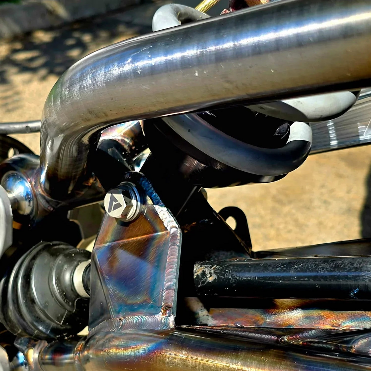 AVID Racing ADS Eyelet and Spring Perch Kit mounted on vehicle with precision titanium hardware