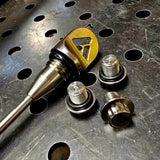 AVID Racing Can-Am Maverick R Dipstick and Titanium Hardware anodized gold on metal shop bench