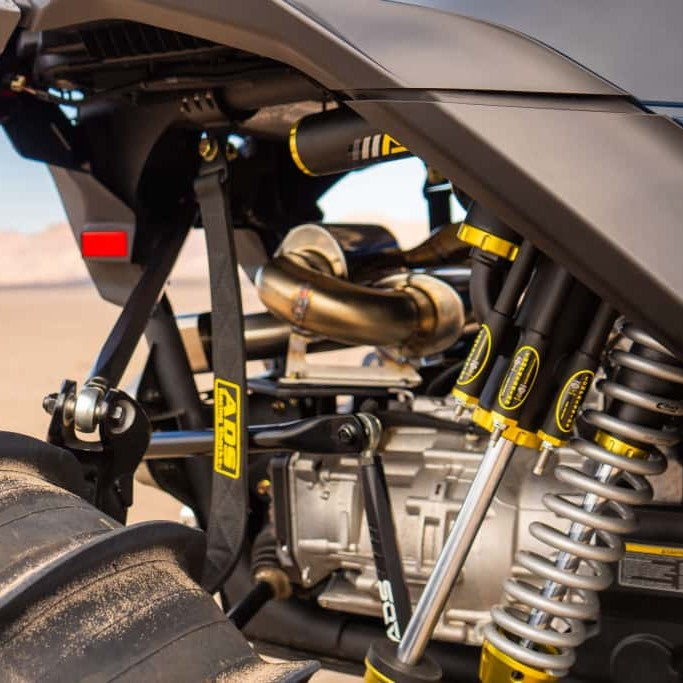 AVID Racing Can-Am Maverick R Rear Race Trailing Arm and Dual Shock Conversion Kit detail view mounted on vehicle