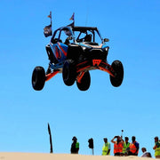 Polaris Pro R LT80" Front Baja Kit - AVID Racing jumping in the sand dunes at Huckfest UTV takeover