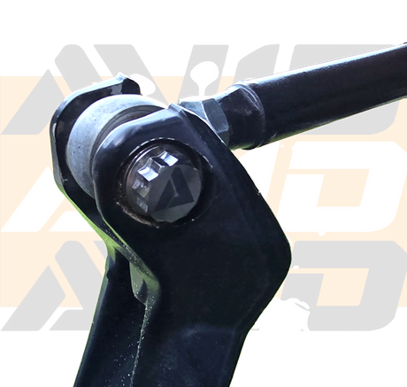 AVID Racing Upper Control Arm Titanium Hardware Dress-Up Kit close up of bolt mounted on vehicle
