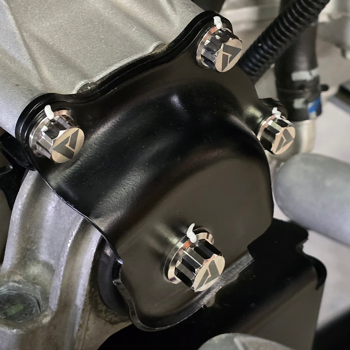 AVID Titanium Polaris Pro R engine mounting titanium hardware mounted on vehicle with 12 point bolt
