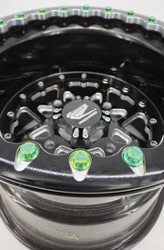 AVID Racing 12 point precision titanium hardware kit mounted on packard wheels anodized green close up view