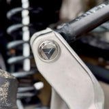 AVID Racing Upper Control Arm Titanium Hardware Dress-Up Kit close up of bolt mounted on vehicle