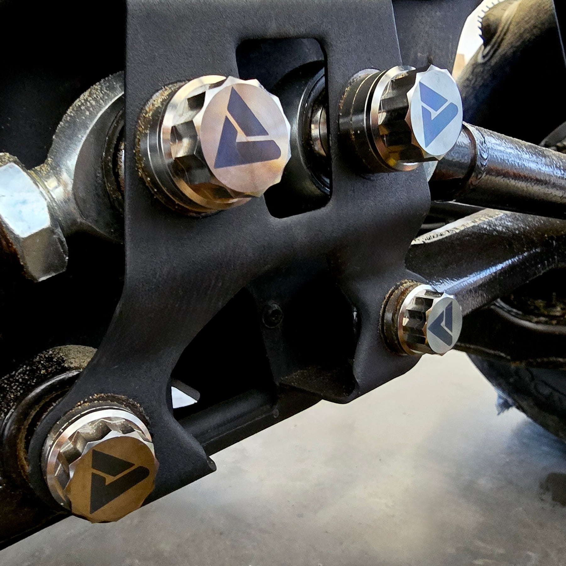 Can-Am Maverick R radius rod plate titanium hardware installed reference