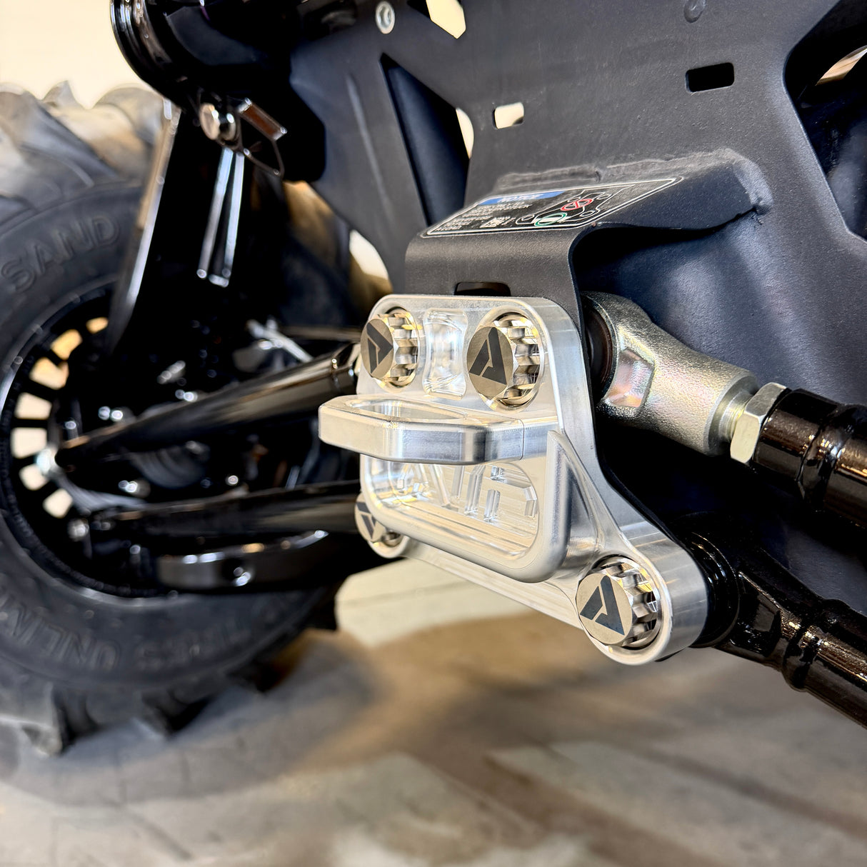 Can-Am Maverick R radius rod plate hardware reference image