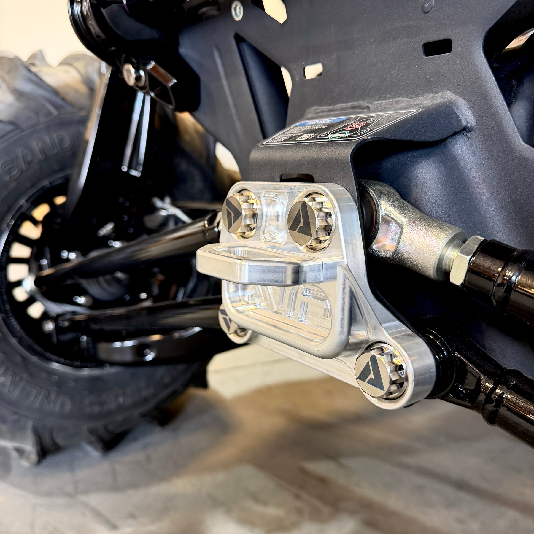 Can-Am Maverick R radius rod plate hardware reference image