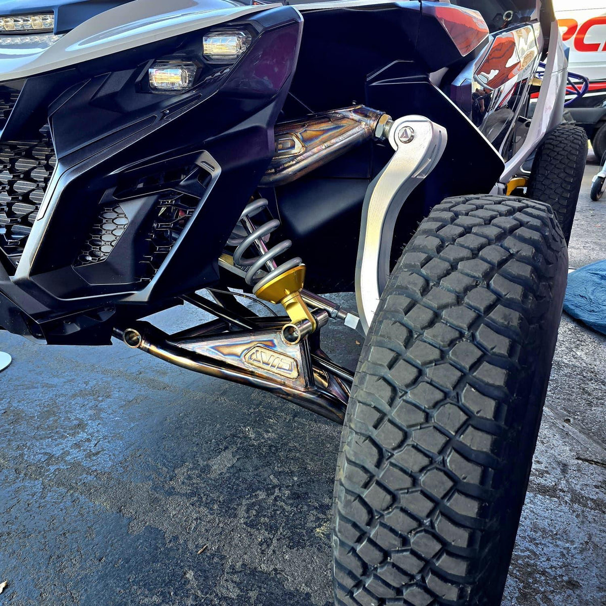 AVID Racing Can-Am Maverick R Baja Race Front Control Arm Kit left view mounted on vehicle