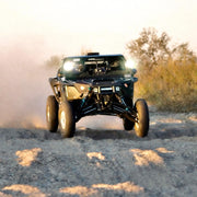 Polaris Pro R LT80" Baja front suspension kit mounted on vehicle racing the the sand